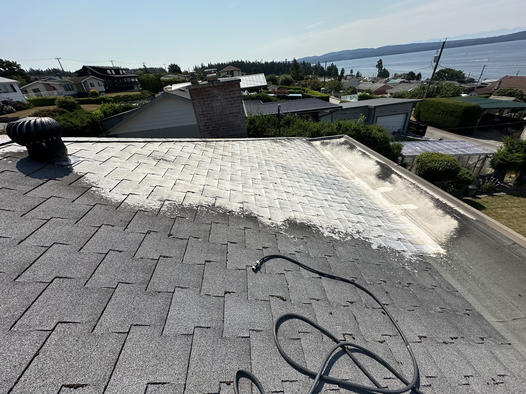 Clean gutter along a shingle roof